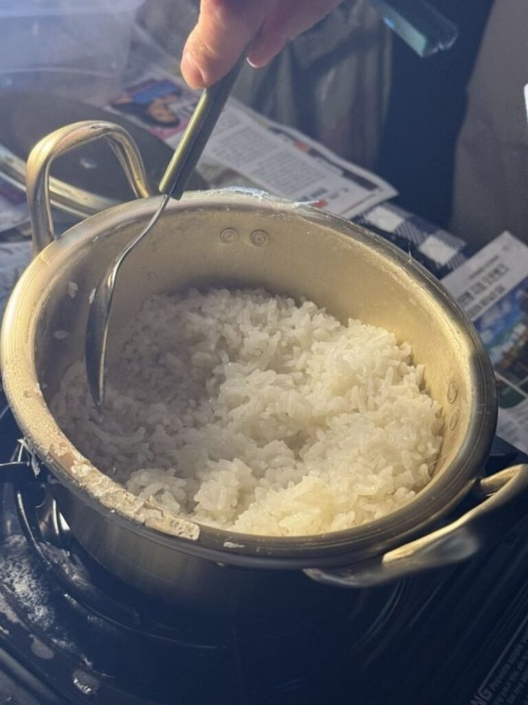 Rice cooking in a pot while camping