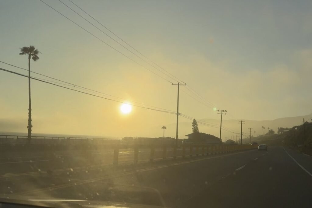 Driving toward Malibu at sunset on the way to a first car camping trip