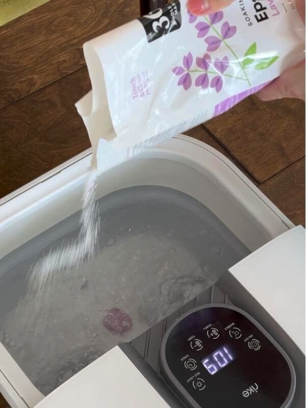 My Wellness Morning Routine: From Exhausted to Energized Pouring Epsom salt into a warm foot bath for muscle recovery