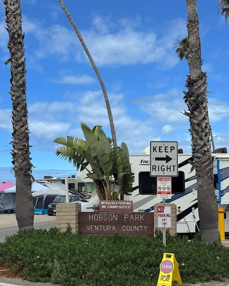Hobson Park Ventura County entrance sign framed by tall palm trees