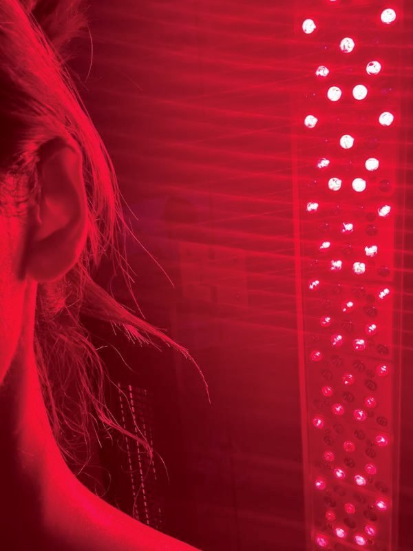 My Wellness Morning Routine: From Exhausted to Energized Red light therapy panel during a sauna recovery session