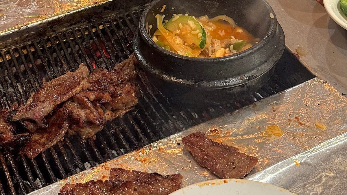 Dog Friendly San Francisco: Two Days With Three Small Dogs Galbi grilling on a tabletop grill next to a pot of stew at a Korean barbecue restaurant in San Francisco