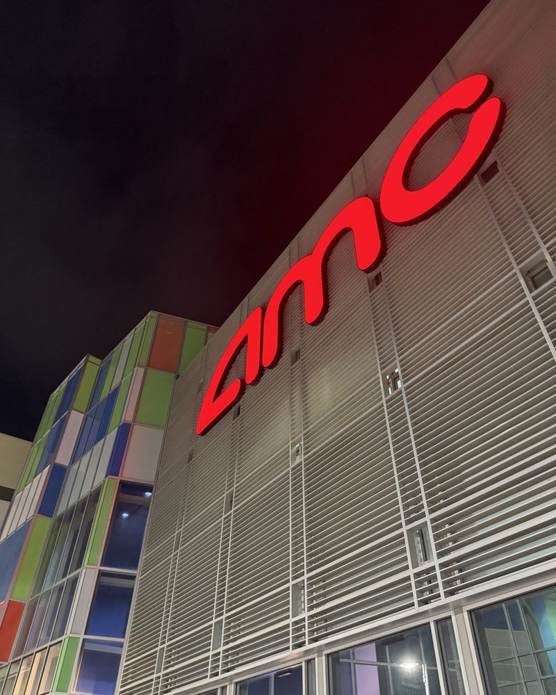 Red AMC theater sign glowing against the night sky after my Primetime showing
