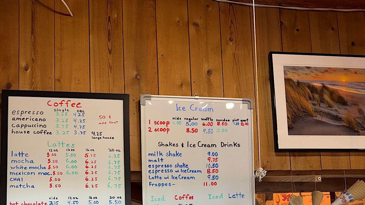 Westside Regional Park Camping With Dogs: What We Wish We'd Known Handwritten coffee and ice cream menu board inside a small coffee shop in Bodega Bay