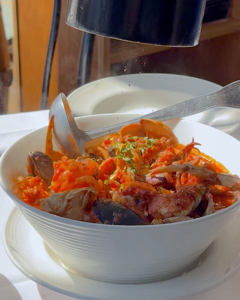 Dog Friendly San Francisco: Two Days With Three Small Dogs Large bowl of cioppino full of clams and shrimp at a North Beach seafood restaurant in San Francisco