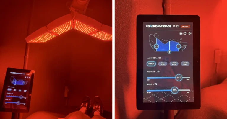 Hydromassage bed under a red LED panel next to a tablet showing massage settings