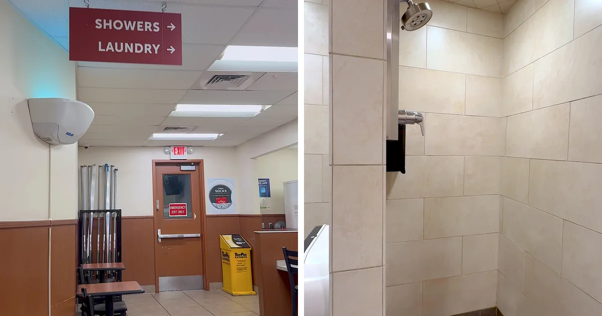Showers and laundry sign inside a travel center next to a clean tiled shower stall