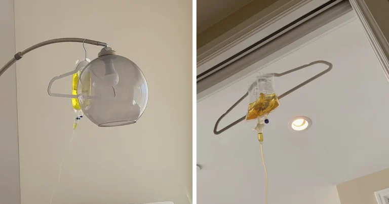 A yellow IV bag hanging from a floor lamp next to an orange IV bag hanging from a hanger in a doorway