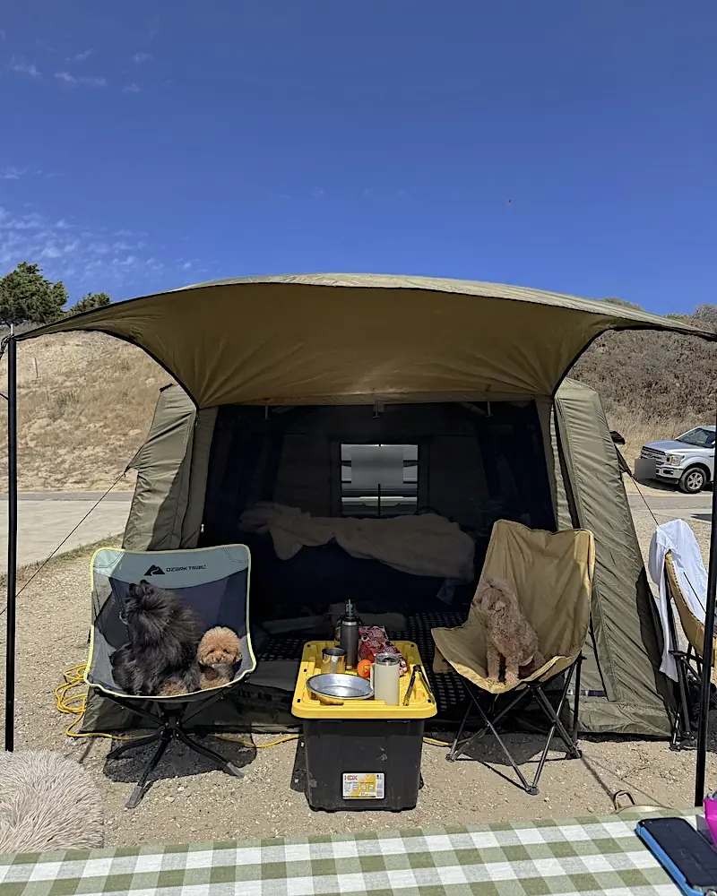 Air Tent Setup Mistakes Air tent setup mistakes first time campers make are worth it for this, an inflatable tent standing with its awning out and two small dogs in camp chairs