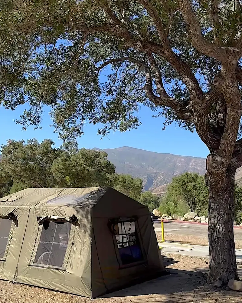 Steckel Park Camping With 3 Dogs: Our Honest Review of This Oak-Shaded Campground Steckel park camping site with a green air tent under a big oak and mountains behind
