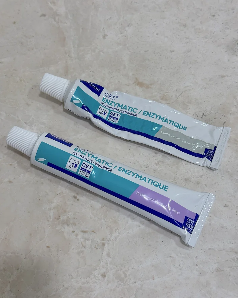 How Often to Brush Dog Teeth (Our Nightly Routine With 3 Small Dogs) Two tubes of Virbac C.E.T. enzymatic dog toothpaste, poultry flavor and beef flavor
