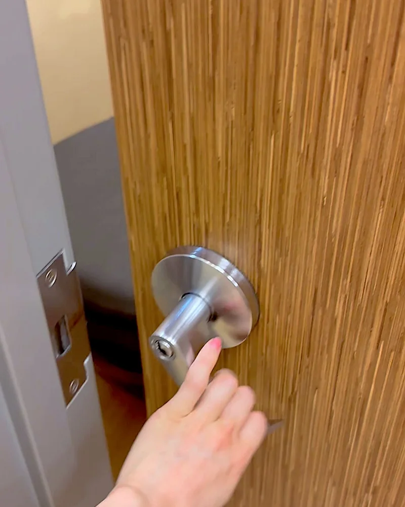 Hydromassage Bed: My Honest Review After 10+ Sessions (and the Exact Settings I Use) Hand opening the door to a private wellness room