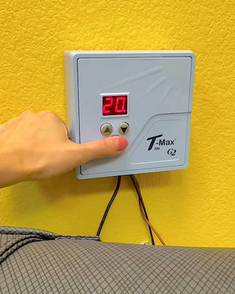 Tanning Salon Red Light Therapy: My Honest Routine After 10+ Face Sessions Hand pressing the button on a wall timer that reads 20