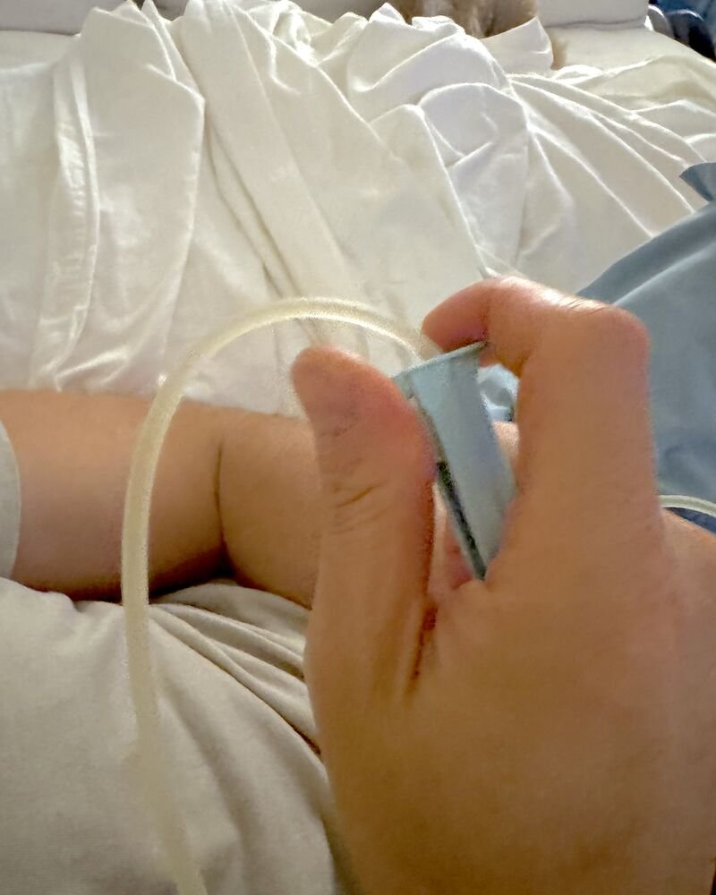 How Long Does an IV Drip Take? My 90-Minute vs 6-Hour Drips A hand on the small blue roller clamp on the IV tubing, the part that sets how fast the drip runs