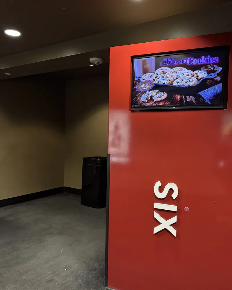 Is The Social Reckoning Worth Seeing? My 7.5/10 Review (No Spoilers) Red wall with the word SIX marking the entrance to auditorium 6 at AMC