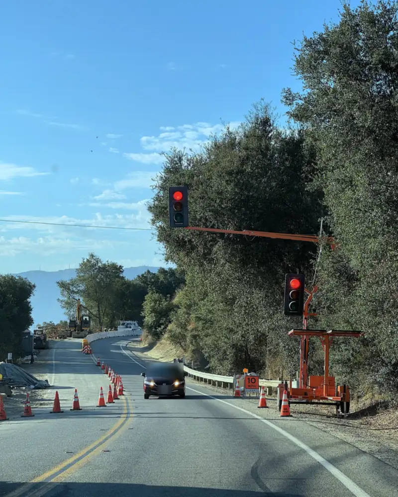 Steckel Park Camping With 3 Dogs: Our Honest Review of This Oak-Shaded Campground Temporary construction traffic light and orange cones on the two-lane road near Steckel Park